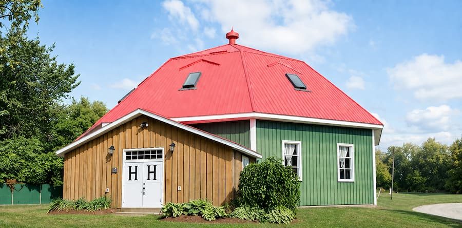 Heritage Hall, the 1931 octagon building on the Beachburg fairgrounds, with its red roof and green and pine board siding